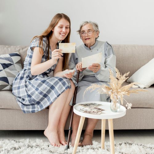 grandmother-checking-old-pictures-with-grandaughter-resized